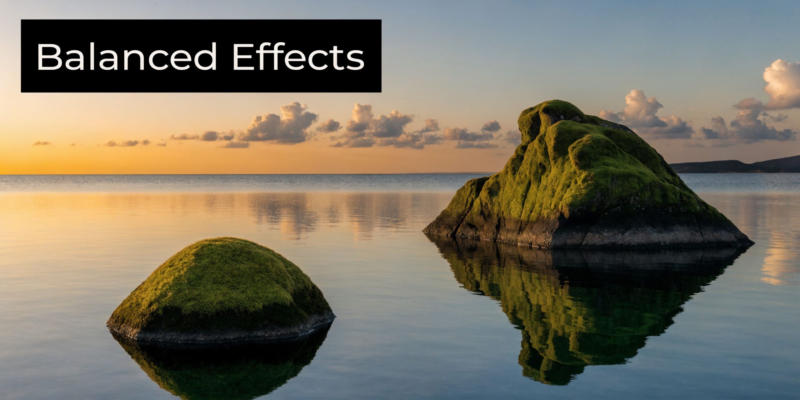 A scenic landscape featuring two mossy rocks emerging from calm water under a soft sunset sky.