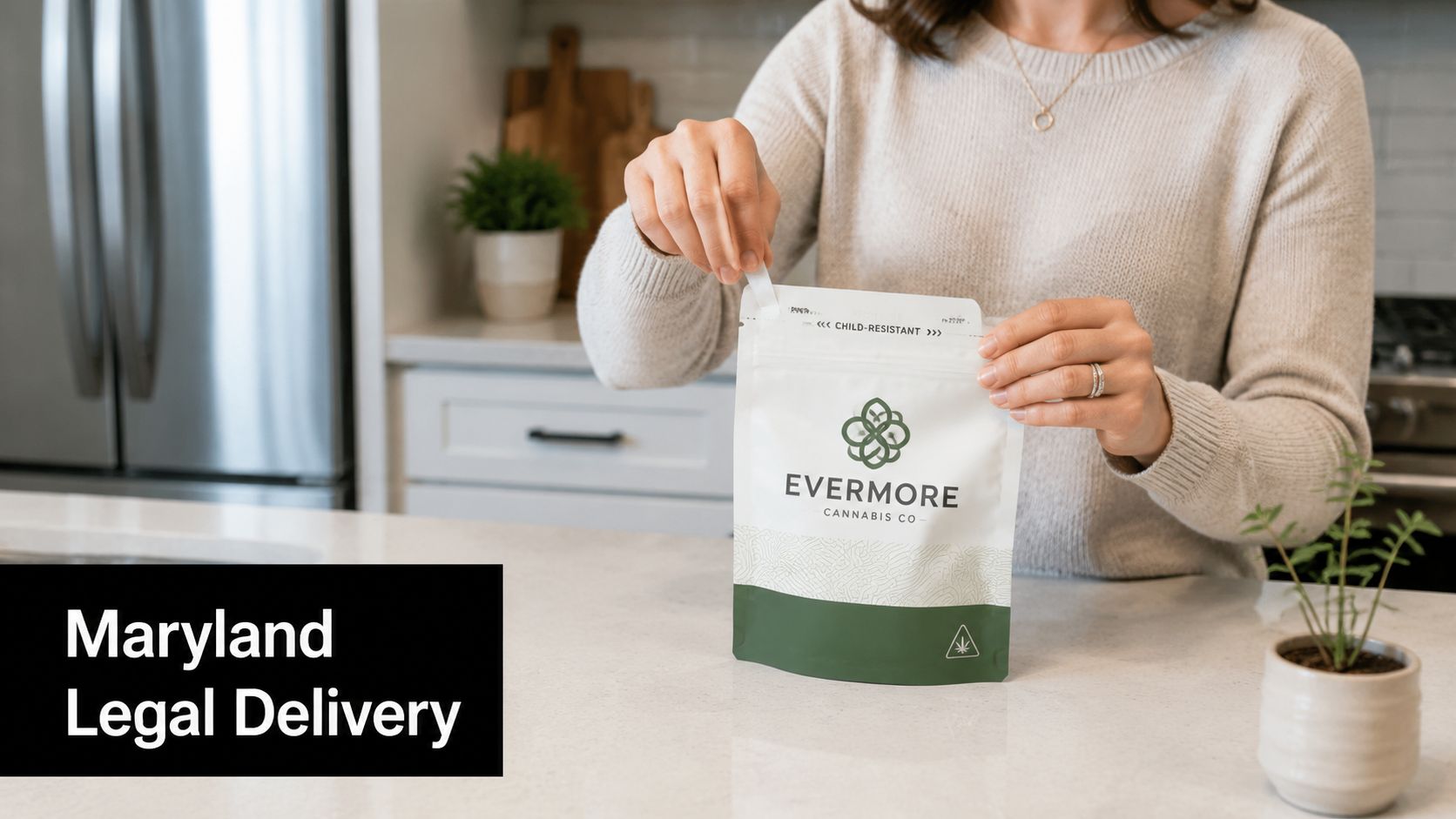 A person opening a child-resistant package from Evermore Cannabis Co in a modern kitchen setting.