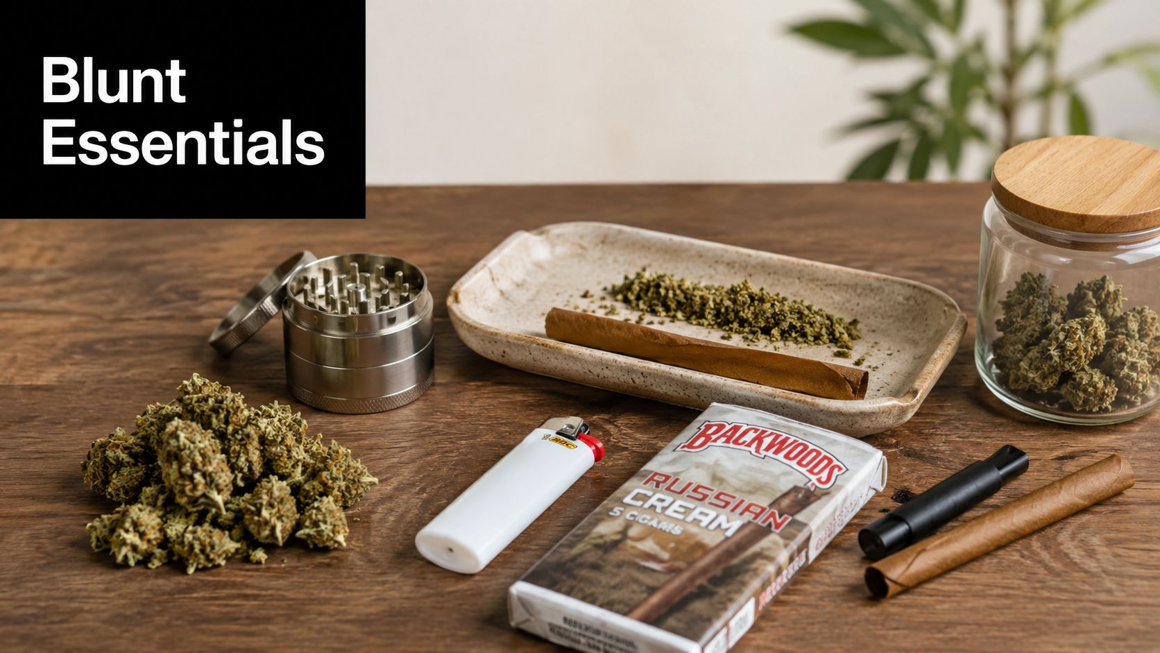 A wooden table featuring cannabis buds, a metal grinder, a lighter, a pack of Backwoods cigars, and rolling supplies.